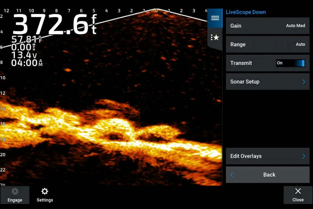 Fishfinder sonar screen displaying underwater terrain and fish at a depth of 372.6 feet with various settings and data on screen.