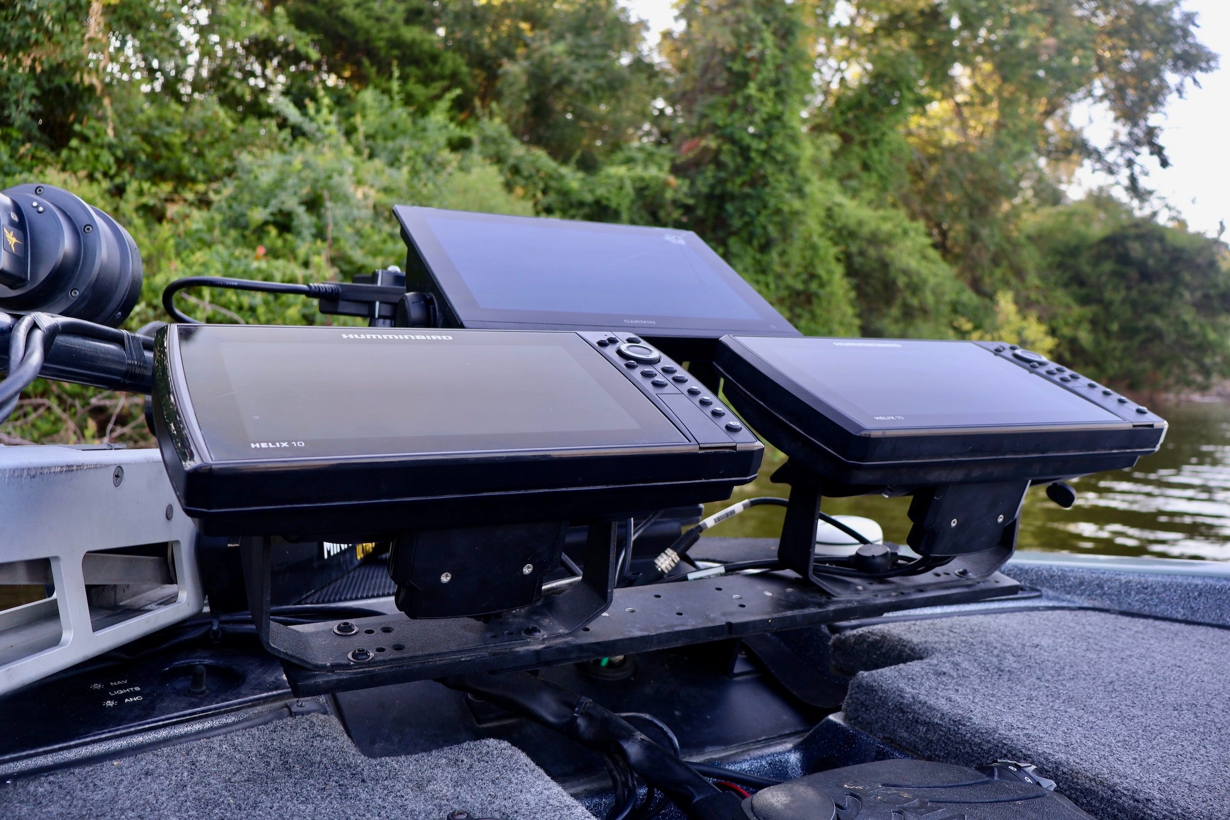 Fishfinder device on a boat with a natural background