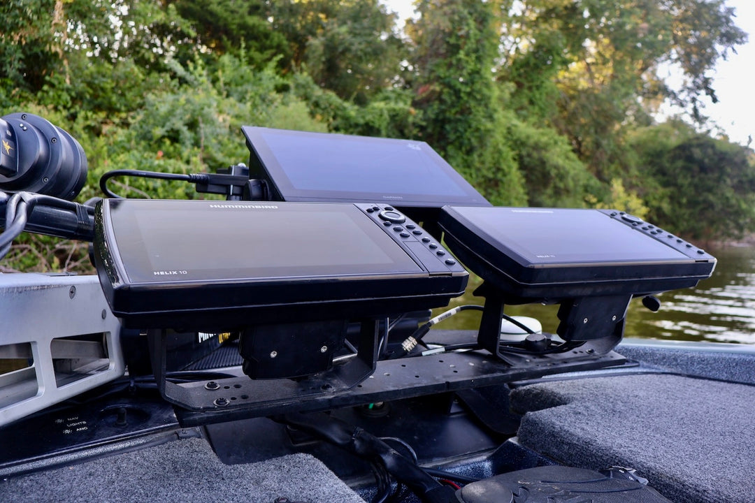 Fishfinder device on a boat with a natural background