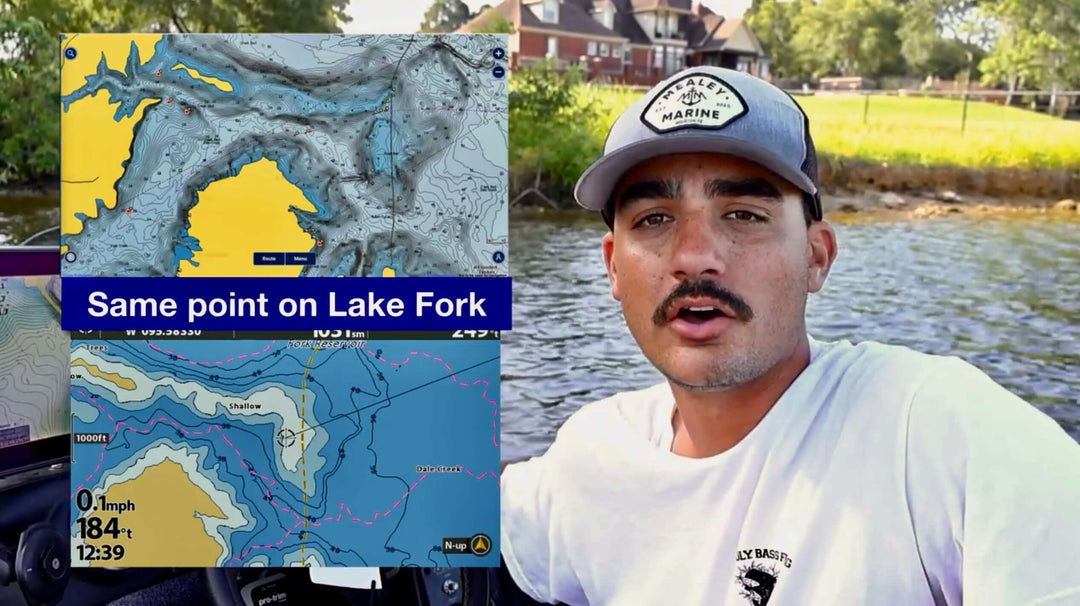 "Man discussing Lake Fork map details while boating, featuring navigational charts and landscape in the background."